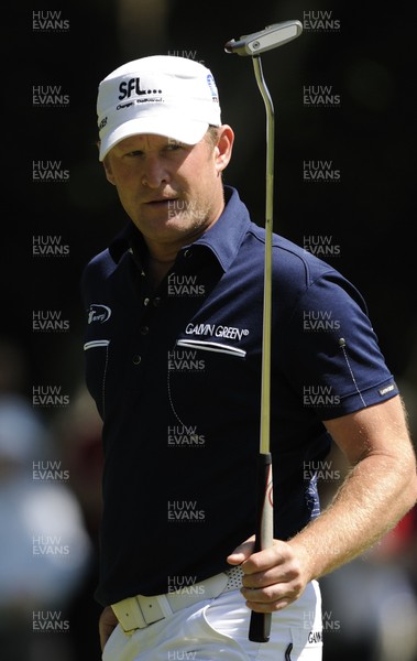 22.05.10... BMW PGA Championship - Jamie Donaldson acknowledges his birdie putt on the first hole on day 3 at the 2010 BMW PGA Championship on the West Course, Wentworth Club, Virginia Water, Surrey 