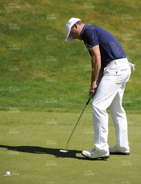 22.05.10... BMW PGA Championship - Jamie Donaldson's putt finds the centre of the cup on the third hole on day 3 at the 2010 BMW PGA Championship on the West Course, Wentworth Club, Virginia Water, Surrey  