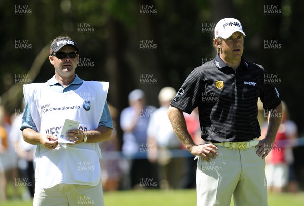 22.05.10... BMW PGA Championship - Lee Westwood and caddie finding a yardage on day 3 at the 2010 BMW PGA Championship on the West Course, Wentworth Club, Virginia Water, Surrey 