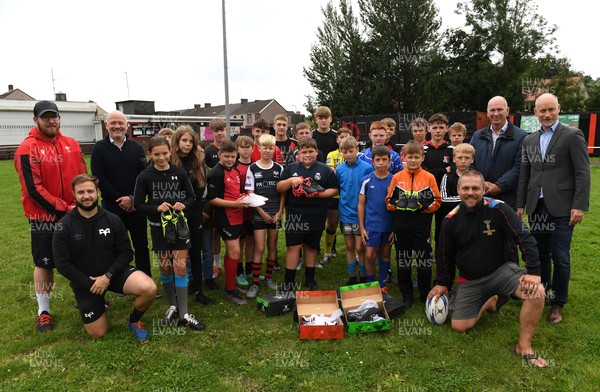 190821 - WRU Kids Rugby Camp at Aberavon Harlequins - Stephen Kinnock MP, Ieuan Evans, David Rees MS and Liam Scott with children on WRU kids camp and Gilbert boots