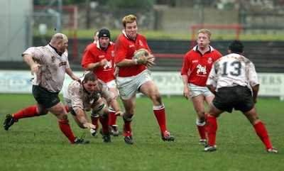 030104 - Aberavon v Llanelli Llanelli's Gavin Quinell tests abeavon's defence  