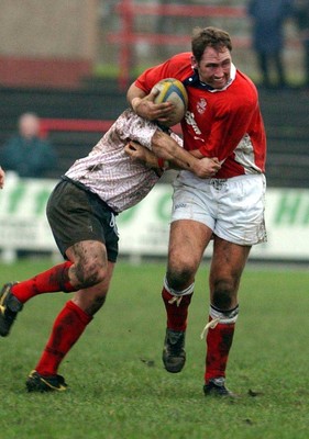 030104 - Aberavon v Llanelli Llanelli's Emyr Lewis searches for a way through  