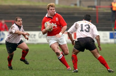 030104 - Aberavon v Llanelli Llanelli's Gavin Quinell looks for a way past Darren Ryan  