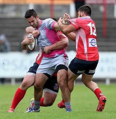 081016 - Aberavon v Llanelli - Principality Premiership - Rheon James of Aberavon is tackled by Simon Gardiner and Gareth Owen of Llanelli