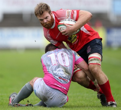 081016 - Aberavon v Llanelli - Principality Premiership - Tom Phillips of Llanelli is tackled by James Garland of Aberavon