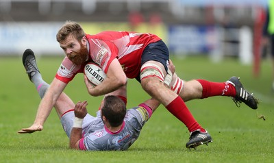 081016 - Aberavon v Llanelli - Principality Premiership - Tom Phillips of Llanelli is tackled by James Garland of Aberavon