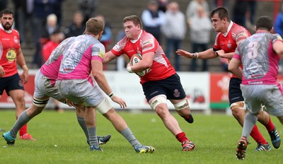 081016 - Aberavon v Llanelli - Principality Premiership - Elliot Rees of Llanelli is tackled by Nathan Brown and Ben Jones of Aberavon