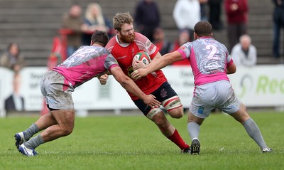 081016 - Aberavon v Llanelli - Principality Premiership - Tom Phillips of Llanelli is tackled by Rheon James and Ieuan Davies of Aberavon