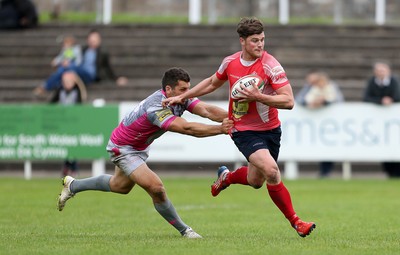 081016 - Aberavon v Llanelli - Principality Premiership - Dion Jones of Llanelli is tackled by Will Price of Aberavon