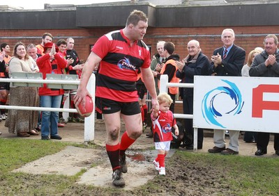 250212 Aberavon RFC v Newport RFC - Principality Premiership -Aberavon's Richard Morris leads the team out with his son James for his 500th appearance 