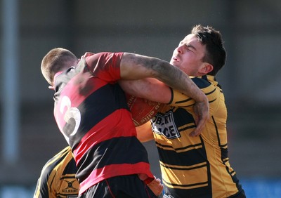 250212 Aberavon RFC v Newport RFC - Principality Premiership -Newport's Will Rhys-Hole is tackled by Aberavon's Richard Thomas