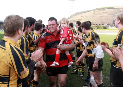 250212 Aberavon RFC v Newport RFC - Principality Premiership -Aberavon's Richard Morris leads his side from the field with son James 