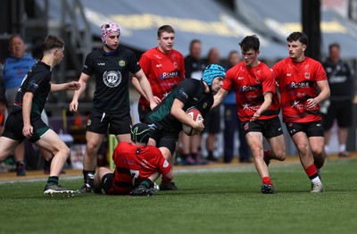 050525 - Abercynon v Llantrisant - U18 Shield Final - Boys U18s Finals Day - Harry Kinsey of Llantrisant is tackled by Harri Williams of Abercynon 