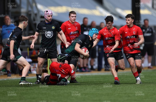 050525 - Abercynon v Llantrisant - U18 Shield Final - Boys U18s Finals Day - Harry Kinsey of Llantrisant is tackled by Harri Williams of Abercynon 