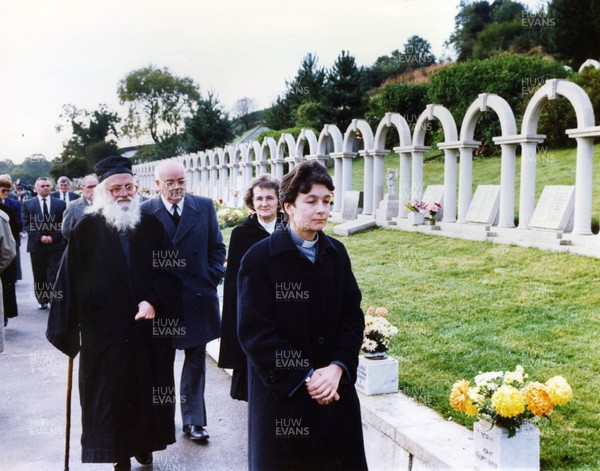 211091 - Picture shows Aberfan disaster anniversary Mourners at the gravesides during the memorial service