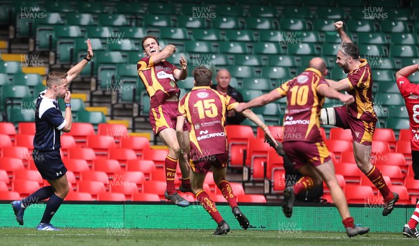 280419 - WRU Finals Day - Abergavenny RFC v Oakdale RFC - Anthony Squire of Abergavenny celebrates scoring the game winning try with team mates