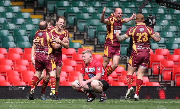 280419 - WRU Finals Day - Abergavenny RFC v Oakdale RFC - Anthony Squire of Abergavenny celebrates scoring the game winning try with team mates