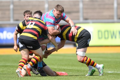 110525 - Aberteifi RFC v Newport Saracens - Mens Division 3 Cup Final - Ewan Burrows of Newport Saracens is challenged by Iwan John of Aberteifi