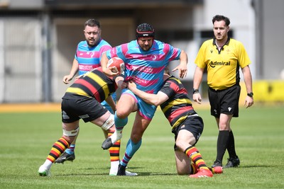 110525 - Aberteifi RFC v Newport Saracens - Mens Division 3 Cup Final - Gareth Edwards of Newport Saracens is challenged by Dean Harries of Aberteifi