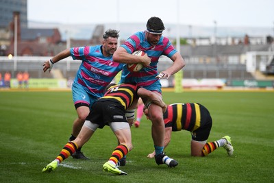 110525 - Aberteifi RFC v Newport Saracens - Mens Division 3 Cup Final - Brian Feeney of Newport Saracens is challenged by Alun Jenkins of Aberteifi