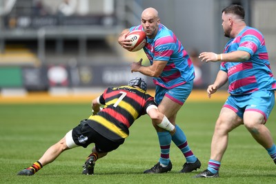 110525 - Aberteifi RFC v Newport Saracens - Mens Division 3 Cup Final - Sam Bevan of Newport Saracens is challenged by Daf Rotie of Aberteifi