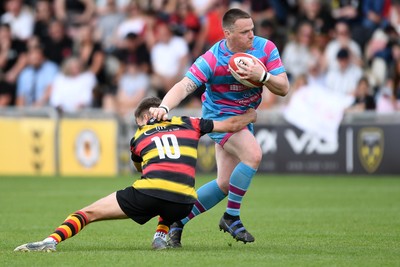 110525 - Aberteifi RFC v Newport Saracens - Mens Division 3 Cup Final - Stef Morgan of Newport Saracens is challenged by Jac Davies of Aberteifi