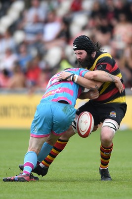 110525 - Aberteifi RFC v Newport Saracens - Mens Division 3 Cup Final - Dan Jones of Aberteifi is challenged by Adam Davies of Newport Saracens