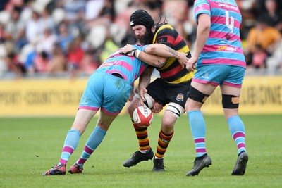 110525 - Aberteifi RFC v Newport Saracens - Mens Division 3 Cup Final - Dan Jones of Aberteifi is challenged by Adam Davies of Newport Saracens