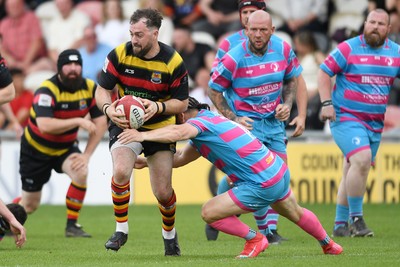110525 - Aberteifi RFC v Newport Saracens - Mens Division 3 Cup Final - Shaun Leonard of Aberteifi is challenged by Dex Lewis of Newport Saracens