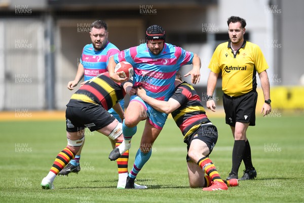 110525 - Aberteifi RFC v Newport Saracens - Mens Division 3 Cup Final - Gareth Edwards of Newport Saracens is challenged by Dean Harries of Aberteifi
