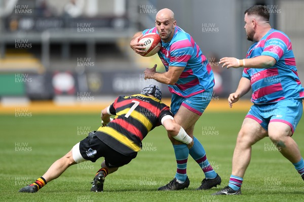 110525 - Aberteifi RFC v Newport Saracens - Mens Division 3 Cup Final - Sam Bevan of Newport Saracens is challenged by Daf Rotie of Aberteifi