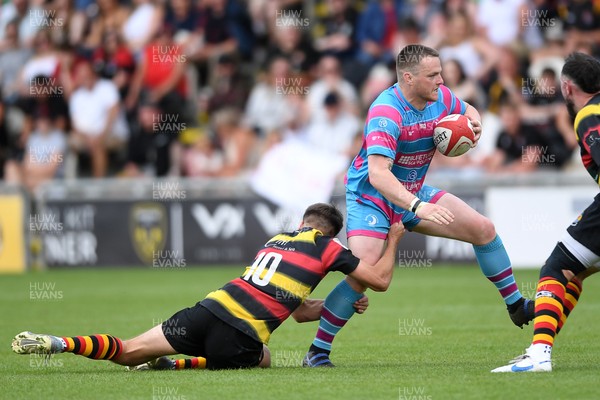 110525 - Aberteifi RFC v Newport Saracens - Mens Division 3 Cup Final - Stef Morgan of Newport Saracens is challenged by Jac Davies of Aberteifi