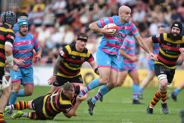 110525 - Aberteifi RFC v Newport Saracens - Mens Division 3 Cup Final - Sam Bevan of Newport Saracens is challenged by Will Brice of Aberteifi