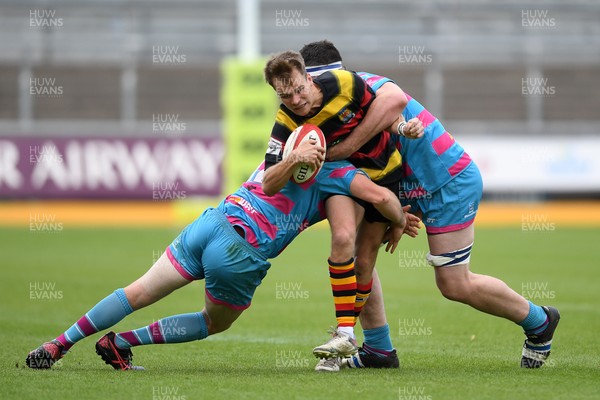 110525 - Aberteifi RFC v Newport Saracens - Mens Division 3 Cup Final - Jac Davies of Aberteifi is challenged by Brian Feeney of Newport Saracens