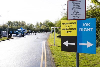 280424 - ABP Newport Marathon - Newport International Sports Village - Signs pointing the way for the marathon, half marathon and 10K