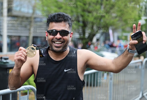 160423 - ABP Newport Wales Marathon & 10K - Runners celebrate at the end of the marathon