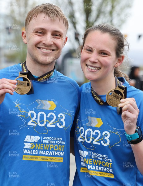 160423 - ABP Newport Wales Marathon & 10K - Runners celebrate at the end of the marathon