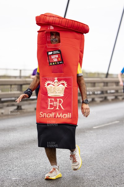 160423 - ABP Newport Wales Marathon and 10K - Runner in a post box costume crosses the Newport Southern Distributor Bridge 