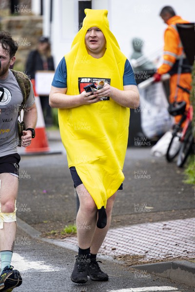 160423 - ABP Newport Wales Marathon and 10K - Runner in a banana costume passes through Magor 