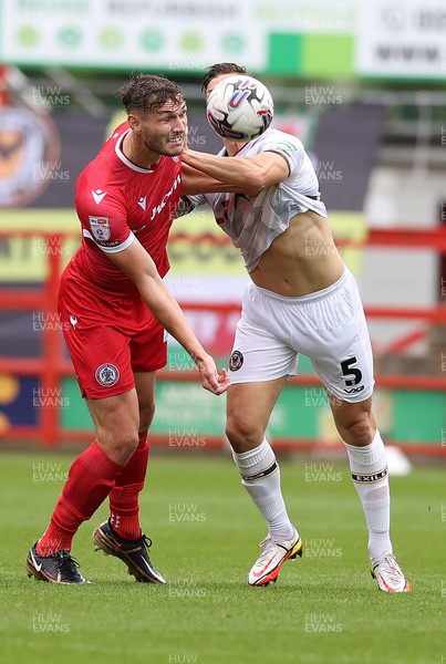 050823 - Accrington Stanley v Newport County - Sky Bet League 2 - James Clarke of Newport County is caught by Josh Andrews of Accrington Stanley