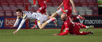 110325 - Accrington Stanley v Newport County - Sky Bet League 2 - Michael Spellman of Newport fall over Farrend Rawson of Accrington