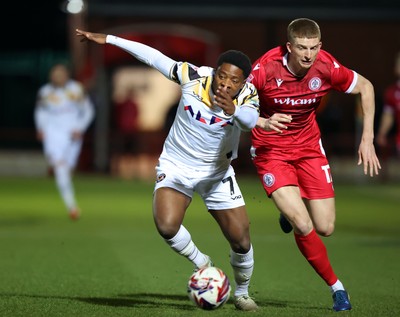 110325 - Accrington Stanley v Newport County - Sky Bet League 2 - Michael Spellman of Newport fall over Farrend Rawson of Accrington