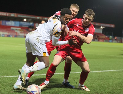 110325 - Accrington Stanley v Newport County - Sky Bet League 2 - Bobby Kamwa of Newport is held off the ball by Donald Love of Accrington