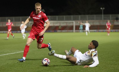 110325 - Accrington Stanley v Newport County - Sky Bet League 2 - Bobby Kamwa of Newport is felled by Devon Matthews of Accrington