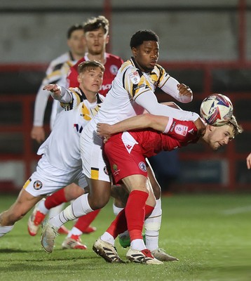 110325 - Accrington Stanley v Newport County - Sky Bet League 2 - Bobby Kamwa of Newport and Kai Whitmore of Newport tackle Seamus Conneely of Accrington