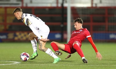 110325 - Accrington Stanley v Newport County - Sky Bet League 2 - Kai Whitmore of Newport and Joe O’Brien-Whitmarsh of Accrington tussle for the ball