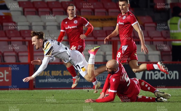 110325 - Accrington Stanley v Newport County - Sky Bet League 2 - Michael Spellman of Newport fall over Farrend Rawson of Accrington