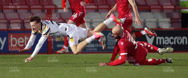 110325 - Accrington Stanley v Newport County - Sky Bet League 2 - Michael Spellman of Newport fall over Farrend Rawson of Accrington