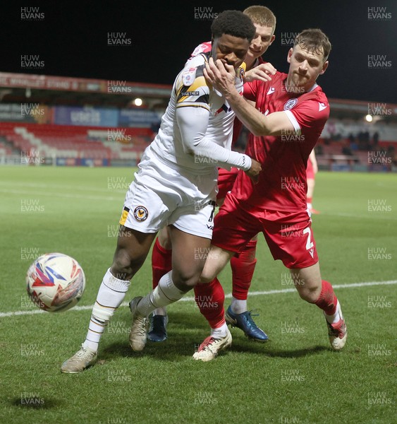 110325 - Accrington Stanley v Newport County - Sky Bet League 2 - Bobby Kamwa of Newport is held off the ball by Donald Love of Accrington