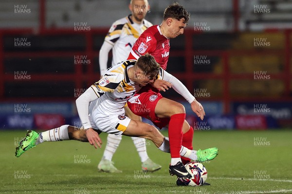 110325 - Accrington Stanley v Newport County - Sky Bet League 2 - Kai Whitmore of Newport and Joe O’Brien-Whitmarsh of Accrington tussle for the ball